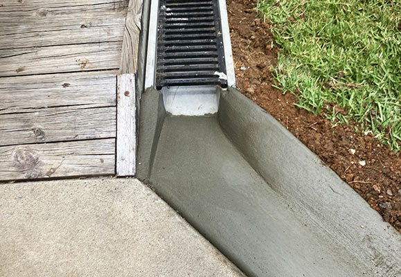 Grated drainage channel installed